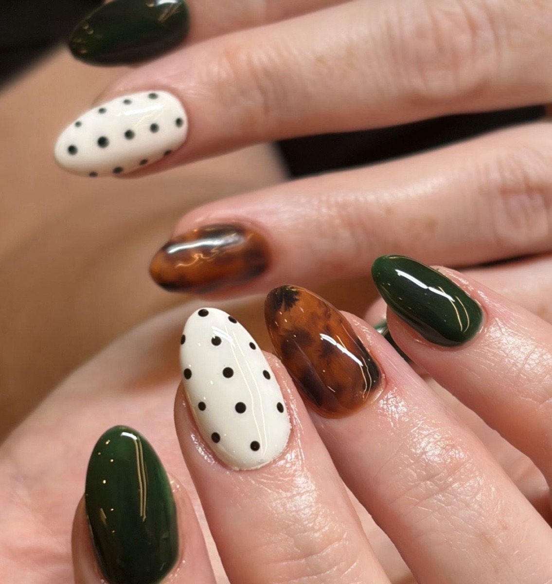 Forest green, tortoiseshell and cream nail detail